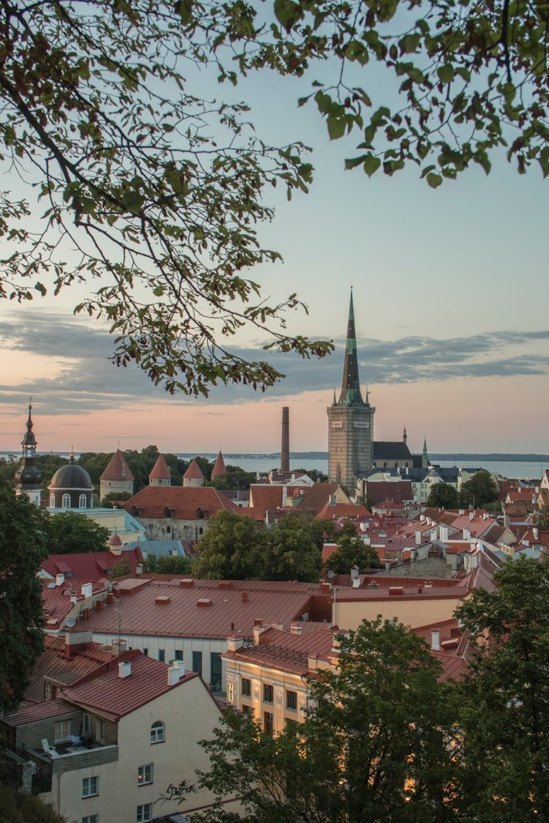 a view of a city with a clock tower in the distance